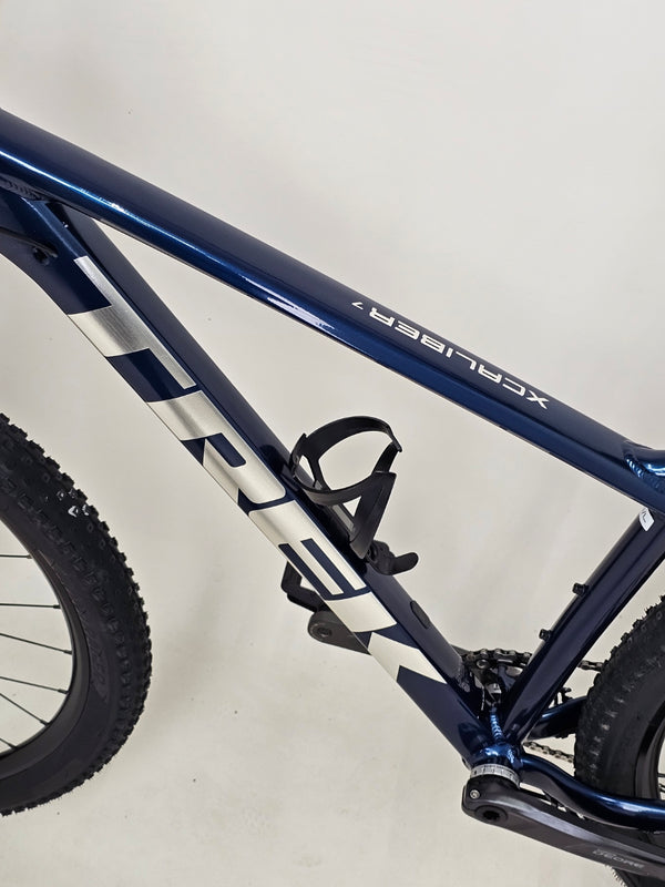 Close-up of the Trek X-CALIBER 7 showing Shimano drivetrain and gear system in excellent condition.