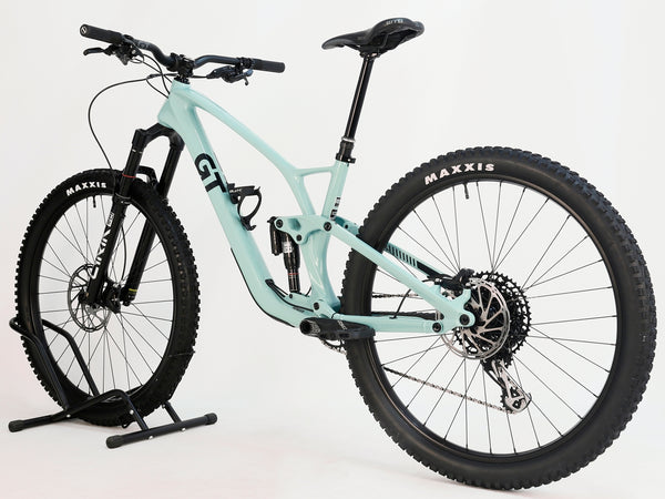 Rear view of the GT Sensor Carbon Pro LE 2024 large mountain bike, emphasizing the suspension and drivetrain.