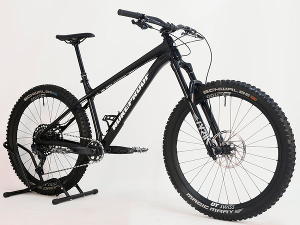 Close-up of the rear wheel of Nukeproof Scout 275 RS 2023 in excellent used condition, highlighting DT Swiss XM1700 rims.