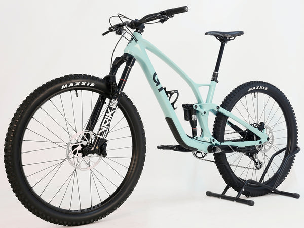 GT Sensor Carbon Pro LE 2024 large full suspension mountain bike in sea green, showcasing the front view with RockShox Lyrik fork.