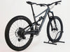 Side view of the Specialized Status 160 mountain bike highlighting its Satin Smoke and Arctic Blue colourway.