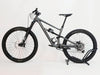 Detailed view of the SRAM NX Eagle 12-speed shifters on the Specialized Status 160, demonstrating gear precision.