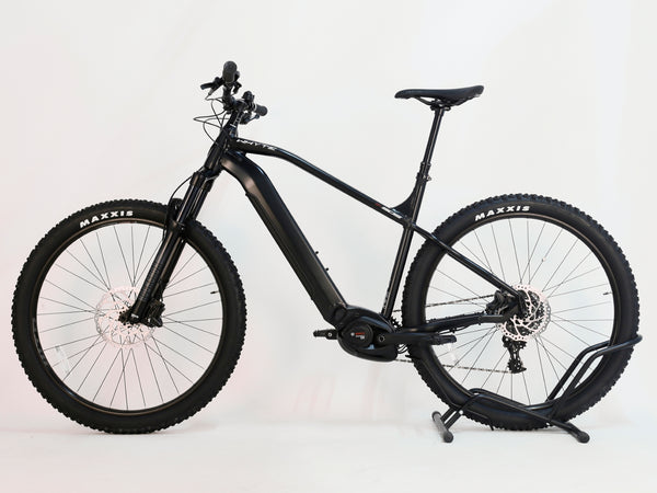 Whyte e-505 v1 Electric Bike 2024 XL model parked in a natural setting, visually demonstrating its pristine condition.