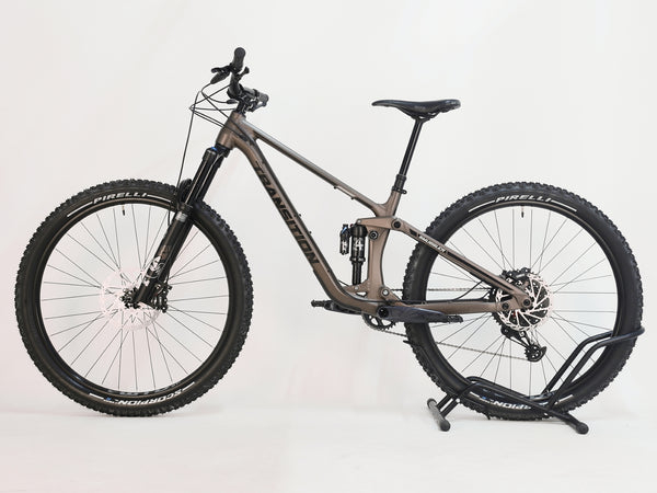 Rear view of the Transition Smuggler NX 2024 in medium, highlighting the SRAM DB8 brakes and Pirelli Scorpion Trail tires.