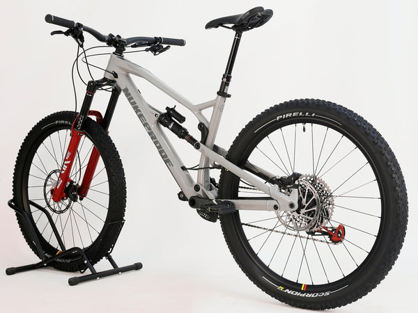 Detailed view of Nukeproof Mega 275 RS X01 Eagle bike's drivetrain and gearing system, emphasizing its performance-ready components.