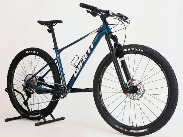 Rear view of the Giant XTC SLR 29 1 2024 model showing Shimano hydraulic brakes.