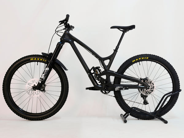 Rear view of the Evil Insurgent LS 27.5 Carbon bike displaying its custom-built design and Cane Creek DBCoil Shock.