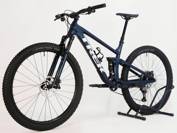 Trek Top Fuel 8 2024 Large Frame Full Suspension Bike at eMado - Side view showcasing the sleek Mulsanne Blue frame.
