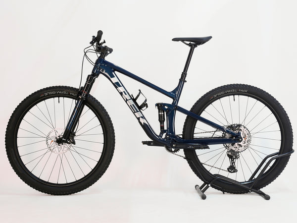 Trek Top Fuel 8 2024 Large Frame Full Suspension Bike at eMado - View of the Shimano XT M8100 shifters on the handlebars.