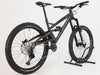 Close-up of the Orange ALPINE 6 mountain bike's Super Deluxe Ultimate Shock suspension system.