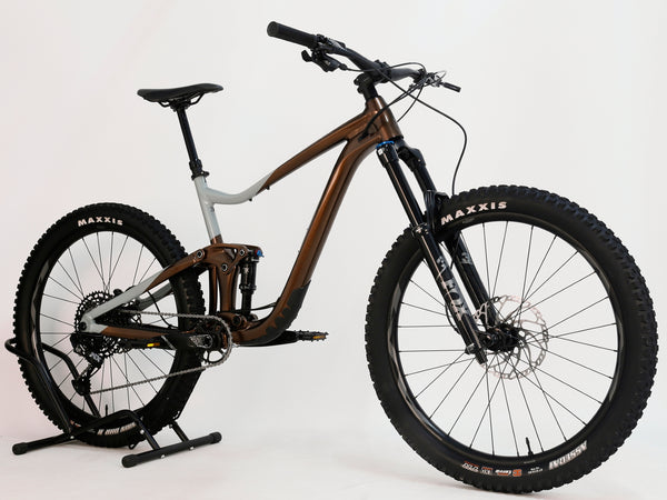 Giant Trance X 2 2023 full suspension mountain bike displayed at an angle, emphasizing the dropper seat post and frame design.