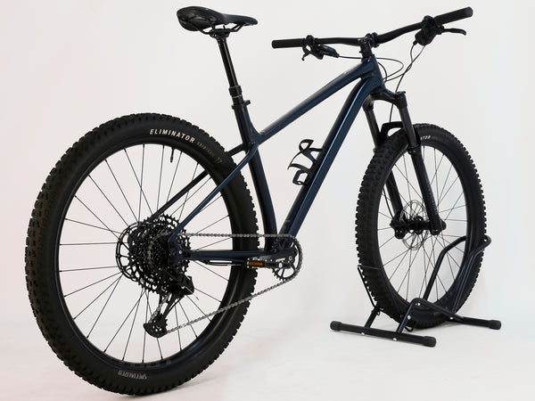 Rear angle view of the Specialized Fuse Sport 27.5 2024 in Excellent Condition at eMado Bikes, showcasing the SRAM drivetrain and hydraulic disc brakes.