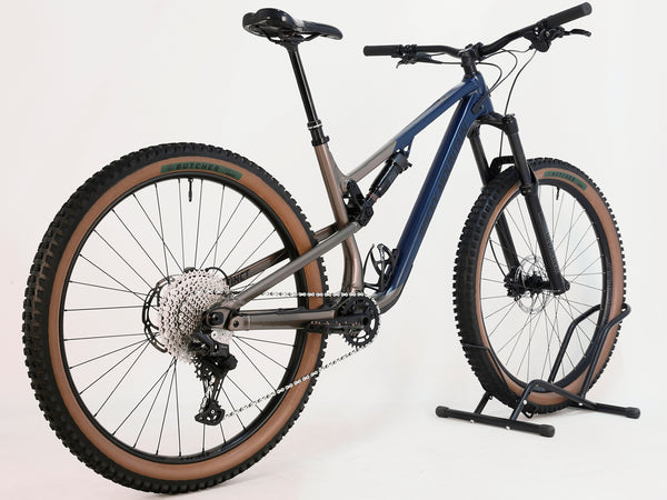 Rear view of Rocky Mountain Instinct Alloy 10 2023 mountain bike, highlighting the Shimano components and robust frame, available at eMado Bikes.