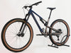 Rocky Mountain Instinct Alloy 10 2023 mountain bike in large size, showcasing its sleek design and brown and blue color scheme, available at eMado Bikes.