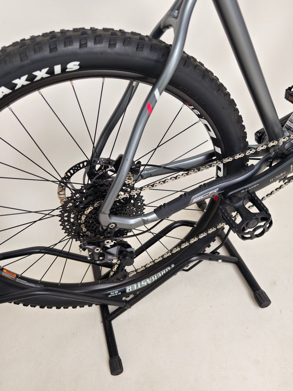 The Whyte 801 V4 2023 mountain bike laid down to show detail of its tires and wheels.