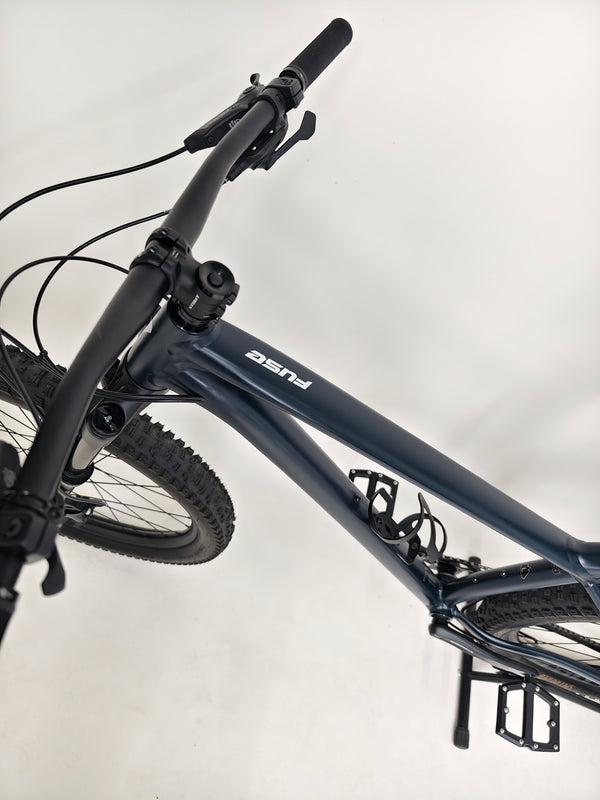 Close-up of the rear brakes on Specialized Fuse Sport 27.5 2024 in Excellent Condition at eMado Bikes, highlighting brake components.