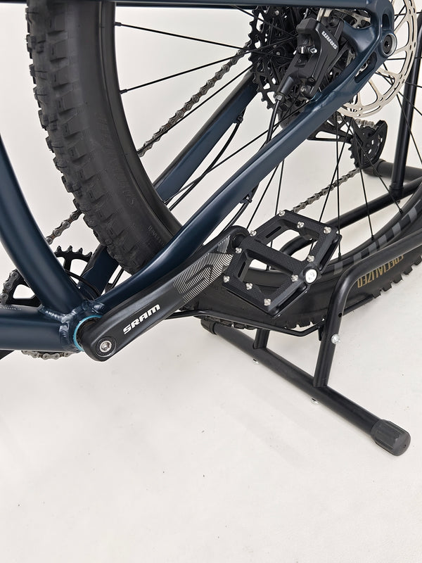 Close-up of the tire tread and sidewall on the Specialized Fuse Sport 27.5 2024 in Excellent Condition at eMado Bikes.