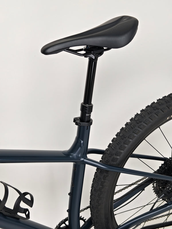 Detailed view of the seat post and saddle angle on Specialized Fuse Sport 27.5 2024 in Excellent Condition at eMado Bikes.