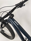 Handlebar close-up showcasing shifters and grips on Specialized Fuse Sport 27.5 2024 in Excellent Condition at eMado Bikes.