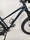 Proximity view of the front tire and fork on the Specialized Fuse Sport 27.5 2024 in Excellent Condition at eMado Bikes.
