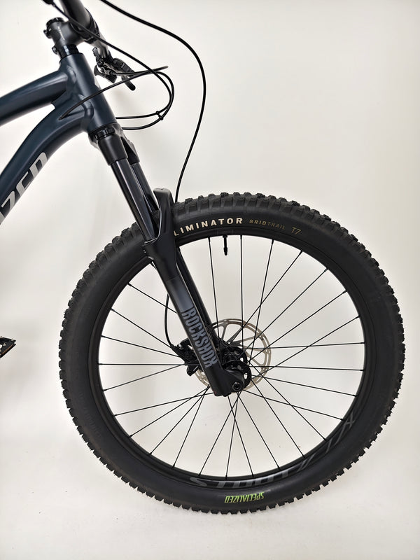 Rear view showcasing the wheel and rear derailleur on the Specialized Fuse Sport 27.5 2024 in Excellent Condition at eMado Bikes.