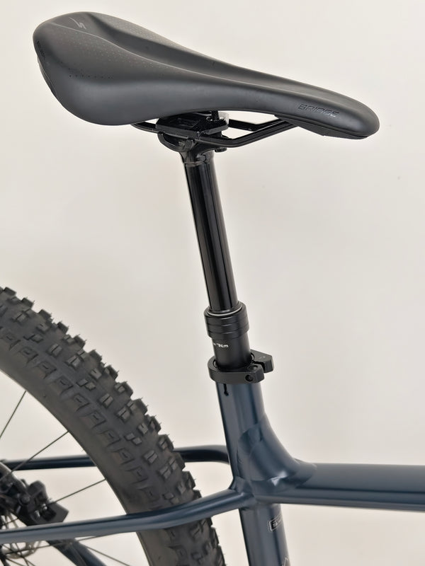 Rear wheel close-up showcasing the disc brake on the Specialized Fuse Sport 27.5 2024 in Excellent Condition at eMado Bikes.