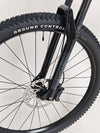 Detailed image depicting the front tire of the Specialized Chisel 2025 Never Used Bike, highlighting its rugged design.