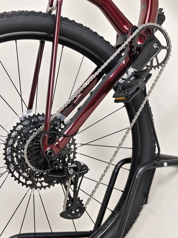 Close-up view of the front wheel assembly of the Specialized Chisel 2025 Never Used Bike, highlighting the disc brake and spokes.