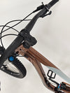 Top-down view of the handlebar setup on Giant Trance X 2 2023 mountain bike, featuring controls and grips.