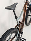 Close-up view of the front axle area on Giant Trance X 2 2023 mountain bike, emphasizing technical details.