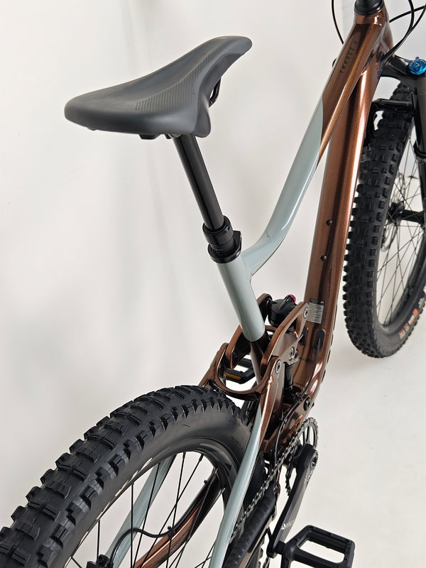 Close-up view of the front axle area on Giant Trance X 2 2023 mountain bike, emphasizing technical details.