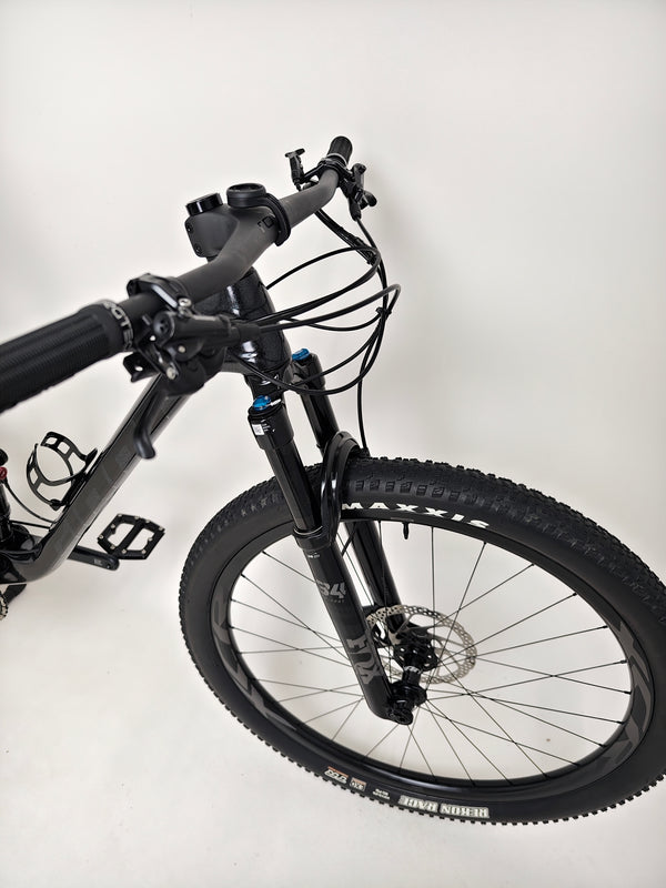 Wide view of the Giant Anthem Advanced Pro 29 2 2023 CARBON bike with scenic nature in the background.