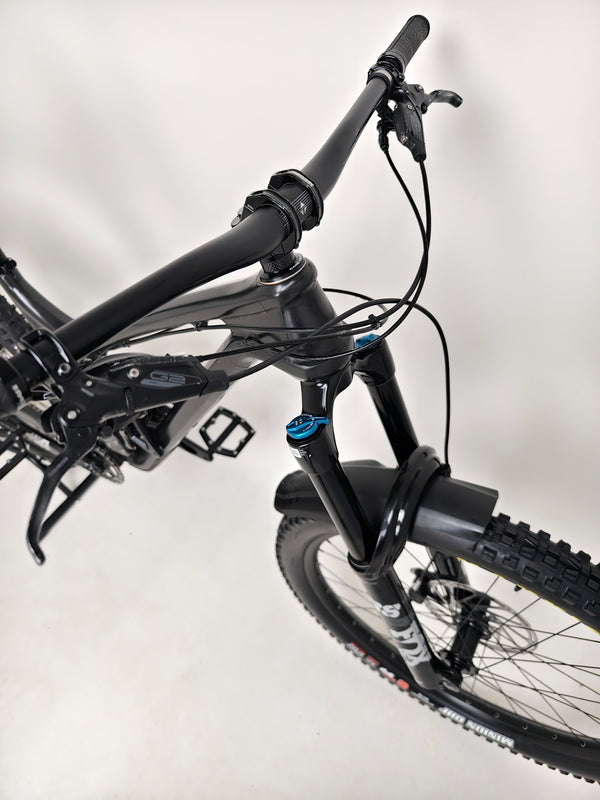 Evil Insurgent LS 27.5 Carbon bike resting on the ground, revealing its full suspension system.