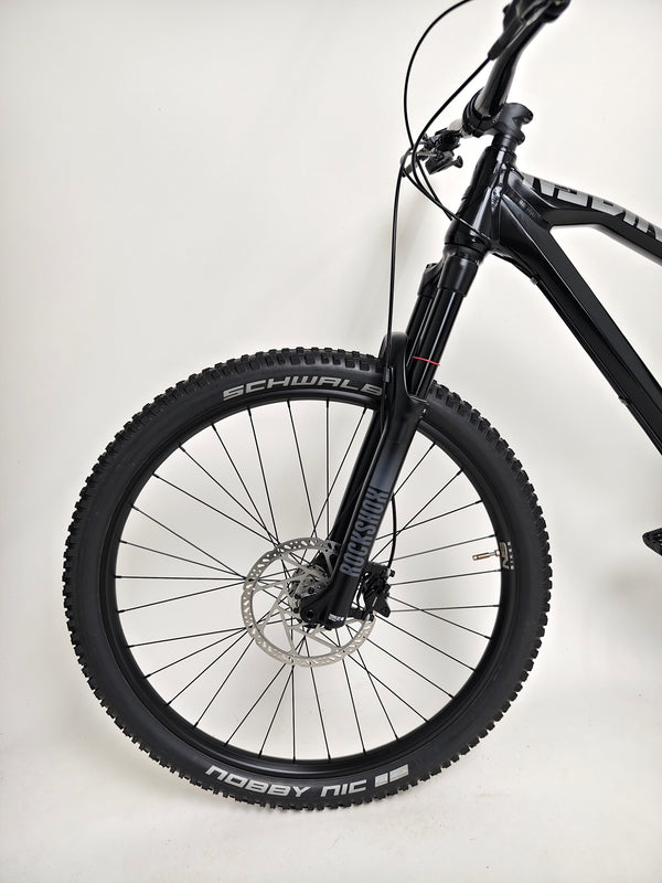 NS Bikes Define AL 130 2 2023 - Close-up of the fork and brake system emphasizing durability and control from NS Bikes.