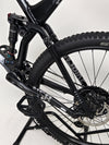 NS Bikes Define AL 130 2 2023 - Detailed view of the bike's mechanics focusing on the front fork and brake details from NS Bikes.