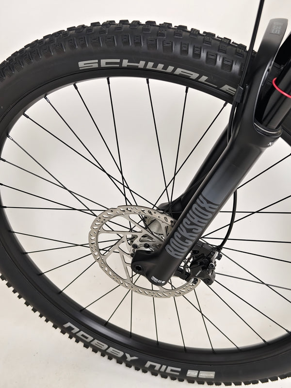 NS Bikes Define AL 130 2 2023 - View capturing the bike's rear fork and rotor design focusing on quality construction from NS Bikes.