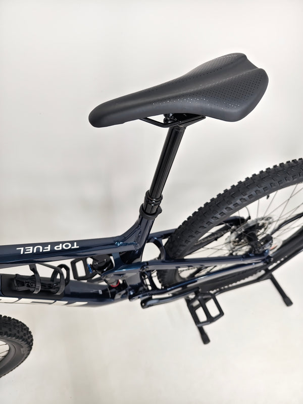 Trek Top Fuel 8 2024 Large Frame Full Suspension Bike at eMado - Photo capturing the bike's suspension and frame geometry.