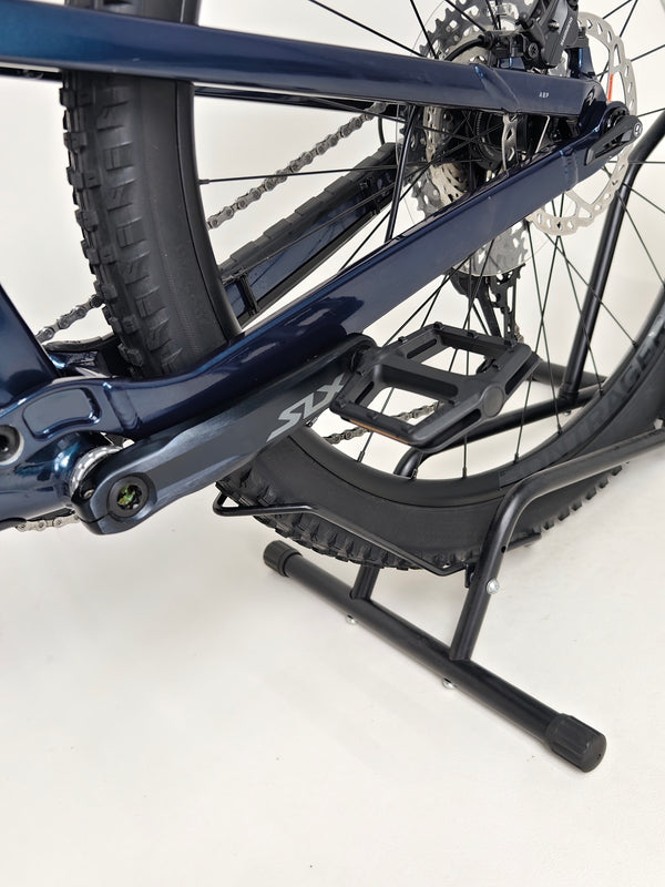 Trek Top Fuel 8 2024 Large Frame Full Suspension Bike at eMado - View showing the bike's profile on an incline.