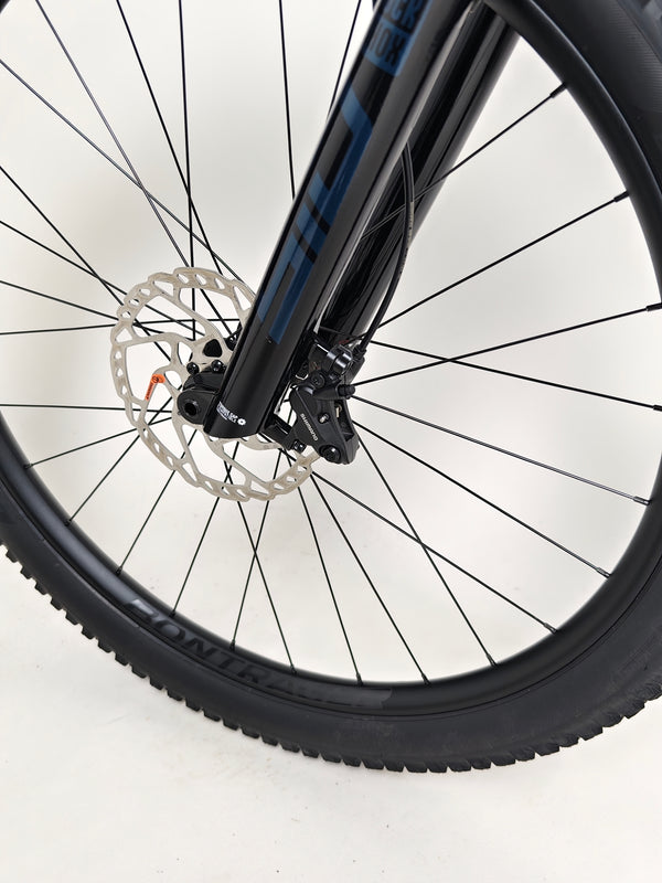 Trek Top Fuel 8 2024 Large Frame Full Suspension Bike at eMado - Close-up of the bike's frame and internal routing features.