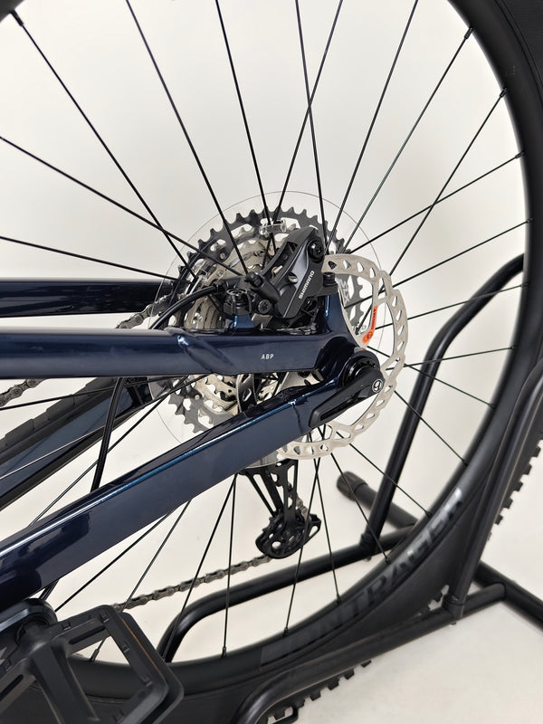 Trek Top Fuel 8 2024 Large Frame Full Suspension Bike at eMado - Perspective shot showing the bike in motion on a trail.