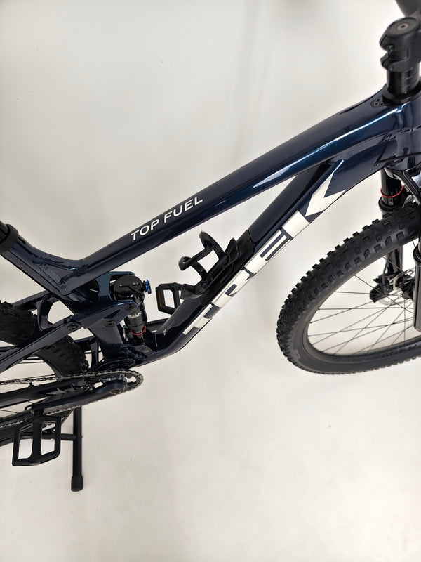 Trek Top Fuel 8 2024 Large Frame Full Suspension Bike at eMado - Image displaying the seat post and dropper functionality.