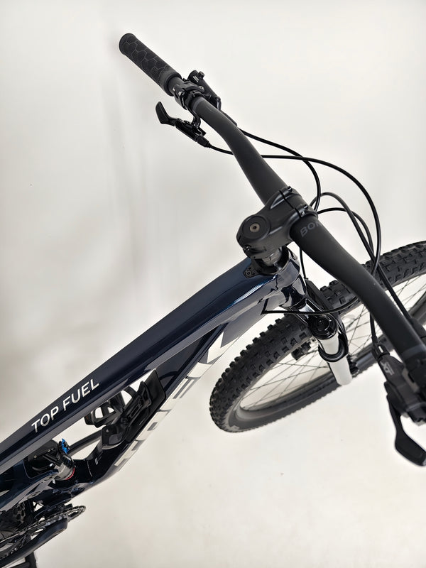 Trek Top Fuel 8 2024 Large Frame Full Suspension Bike at eMado - Side view showing the unique features of the frame.