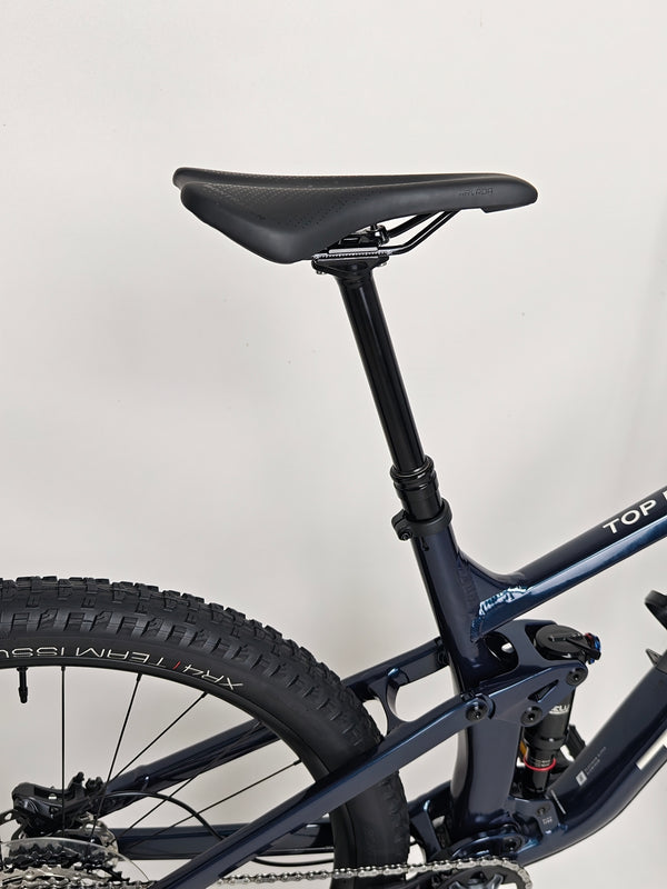 Trek Top Fuel 8 2024 Large Frame Full Suspension Bike at eMado - Clear close-up of the bike's rear linkage and shock setup.