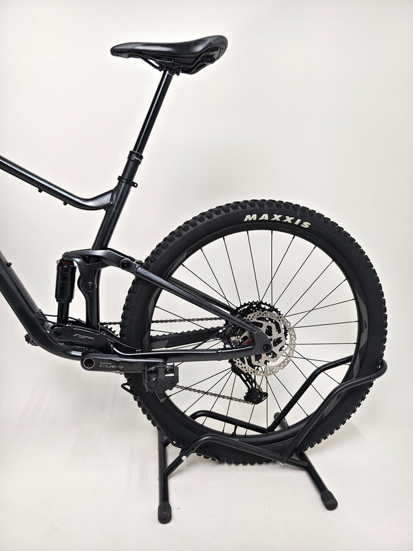 Angle view capturing the front of Giant Stance 29 2 2024/LARGE showing tire and fork details.