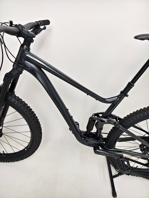 Close-up perspective of the Giant Stance 29 2 2024/LARGE handlebars and controls, showcasing Shimano gear shifters.