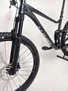 Close-up of the front fork of Giant Stance 29 2 2024/LARGE mountain bike, highlighting suspension details.