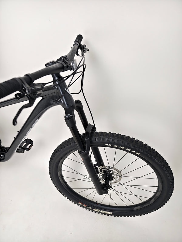 Close-up of the front wheel and fork styling on Giant Stance 29 2 2024/LARGE mountain bike.