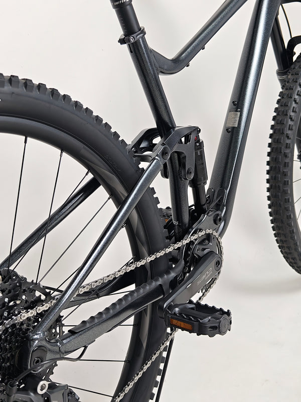 Side profile view of Giant Stance 29 2 2024/LARGE highlighting tire tread pattern and wheel setup.