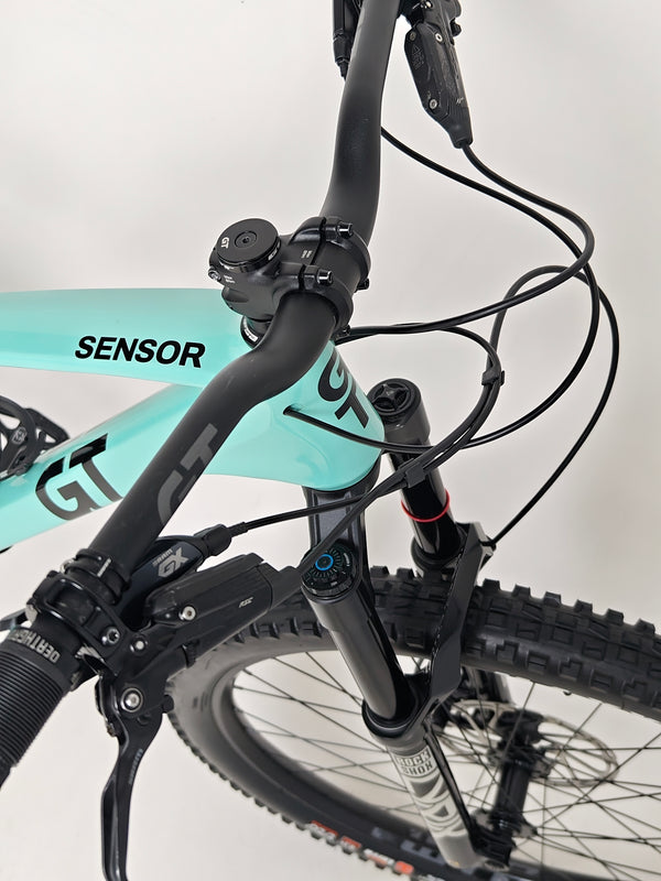 Close-up shot of the frame's down tube displaying brand decals on the GT Sensor Carbon Pro LE 2024 bike.