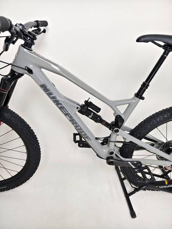 Nukeproof Mega 275 RS X01 Eagle bike showcasing the saddle from the back, highlighting the high-performance seat post.